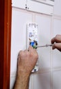 Technician placing the new intercom phone inside the home