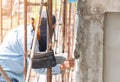 The technician is plastering the edge of the column Royalty Free Stock Photo