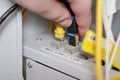 technician plugging ethernet cable into network switch, close-up of internet connection setup, data transfer and technology Royalty Free Stock Photo