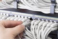 It technician plugs in network cable