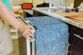 Technician plumber installation of kitchen dishwasher