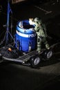 Technician of police bomb disposal unit in action