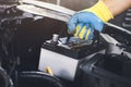 Technician replaced car old battery Royalty Free Stock Photo