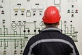 Technician reading instruments in power plant control center Royalty Free Stock Photo