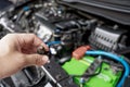 Technician Removing gasoline injector part in engine room maintenance concept