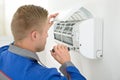 Technician repairing air conditioner Royalty Free Stock Photo