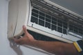 Technician repairing air conditioner Royalty Free Stock Photo