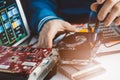 Technician repairing broken hard disk drive Royalty Free Stock Photo