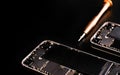 Technician repairing the Cell phone parts and tools for recovery repair phone smartphone and upgrade mobile