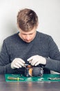 Technician repairing digital camera Royalty Free Stock Photo