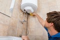 Technician Repairing Electric Boiler Royalty Free Stock Photo