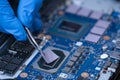 Technician repairing inside of thermal pad for Integrated Circuit. the concept of data
