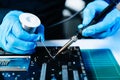 The technician repairing the motherboard in the lab with copy space. the concept of computer hardware, mobile phone, electronic, Royalty Free Stock Photo