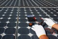 Technician repairing photovoltaic modules Solar panels in rural