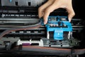 Technician repairing printer, fixing printer head Royalty Free Stock Photo