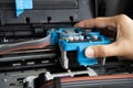 Technician repairing printer, fixing printer head Royalty Free Stock Photo