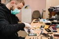 The technician repairing the smartphone motherboard in the lab. Concept of mobile phone, electronic, repairing, upgrade, Royalty Free Stock Photo