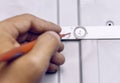 engineer measures the voltage on the led board