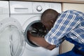 Technician Repairing Washing Machine Royalty Free Stock Photo