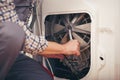 Technician repairing a washing machine Royalty Free Stock Photo