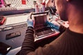 The technician repairs a broken tablet computer in a repair shop Royalty Free Stock Photo