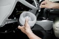 Technician in the service center install and maintenance blower air of car and use screwdriver remove a bolt in process,service Royalty Free Stock Photo