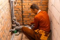 Technician servicing an hot-water heater. Royalty Free Stock Photo