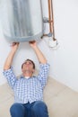 Technician servicing an hot water heater Royalty Free Stock Photo