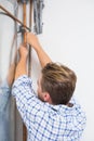 Technician servicing an hot water heater' pipes Royalty Free Stock Photo