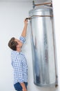 Technician servicing an hot water heater Royalty Free Stock Photo