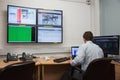 Technician sitting in office running diagnostics Royalty Free Stock Photo