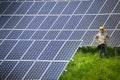 Technician at solar power station Royalty Free Stock Photo