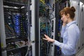 Technician talking on phone while analysing server