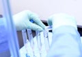 Medical Testing Equipment and Hands Holding Test Tubes Royalty Free Stock Photo