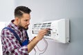 Technician Testing Air Conditioner Royalty Free Stock Photo