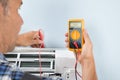 Technician testing air conditioner Royalty Free Stock Photo