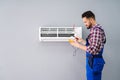 Technician Testing Air Conditioner Royalty Free Stock Photo