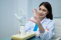 Technician testing robotic bionic arm at prosthetic manufacturing Royalty Free Stock Photo