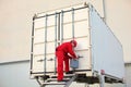 technician with tool case opening movable workshop in container