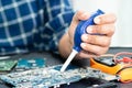 Technician use  air blower ball to clean dust in circuit board computer. Repair upgrade and maintenance technology Royalty Free Stock Photo