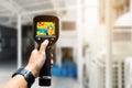 technician use thermal imaging camera to check temperature in fa Royalty Free Stock Photo