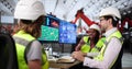 Technician uses computer to monitor production line