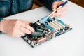 Technician using brush for computer cleaning, clean the motherboard Royalty Free Stock Photo