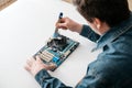 Technician using  brush for computer cleaning Royalty Free Stock Photo