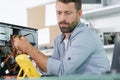 technician using voltage meter for voltage to fix pc Royalty Free Stock Photo