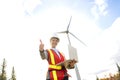 A Technician woman Engineer in Wind Turbine Power Generator Station