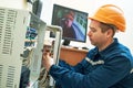 Technician worker adjusting video surveillance system