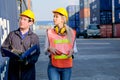 Technician or workers man and woman discuss about the product in cargo container shipping area with day light