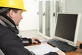 Technician working on the computer in the power plant control c Royalty Free Stock Photo