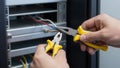 Technician Working with Network Cables and Server Rack Royalty Free Stock Photo